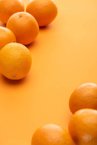 istock ripe delicious whole oranges on colorful background 1227384370