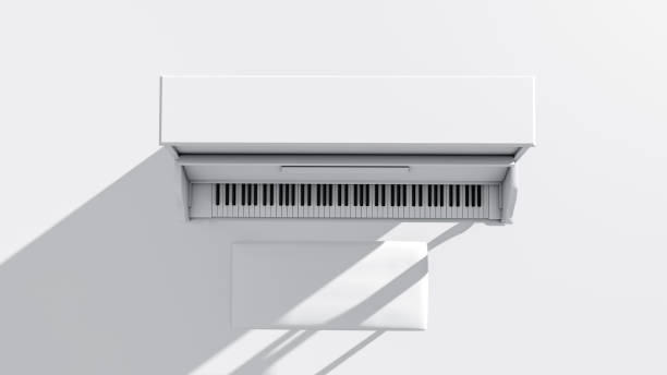 影のある白いピアノのトップビュークローズアップ - piano piano key orchestra close up ストックフォトと画像