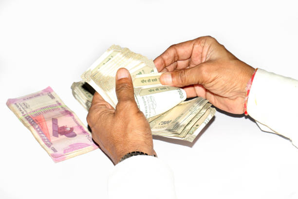 istock Counting of Indian Currency Note 500rs 2000rs in hands 1227385027