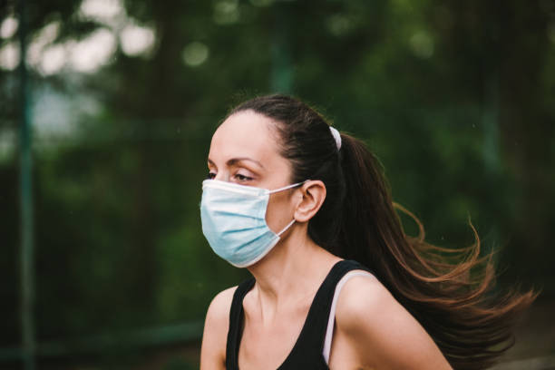 istock Woman jogging down a path boosting her immune system for covid-19 1227386782