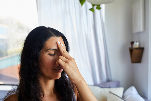 Woman Touching Her Forehead Chakra During A Meditation Session At Home Stock Photo - Download Image Now - iStock Woman Touching Her Forehead Chakra During A Meditation Session At Home Stock Photo - Download Image Now - iStock