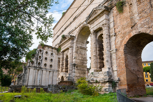 Rome, Italy -- A view of Porta Maggiore (The Greater Gate) built by the emperor Claudius in 52 AD and incorporated into the majestic walls that surrounded and protected the imperial city subsequently built by the emperor Aurelian. Eight of the eleven monumental aqueducts in Rome converged at this point, while tombs and small commemorative monuments dedicated to important personalities of the city stood around it.