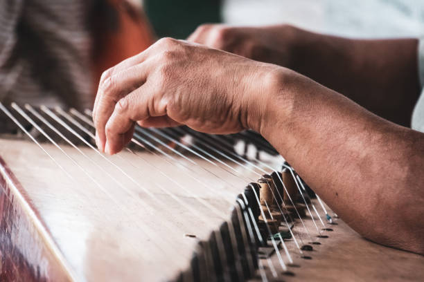 istock Fingers on Kecapi music instrument 1227387825