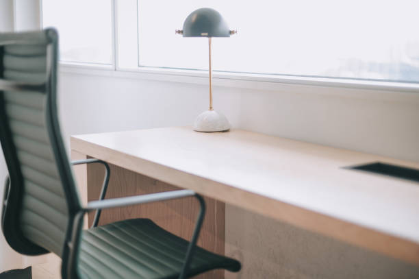 istock office desk and chair facing window with electronic lamp 1227389687