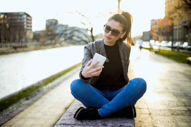 istock Girl make selfie near river 1227389892