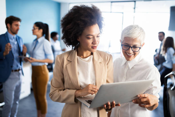 istock Group of successful business people at work in office 1227391566