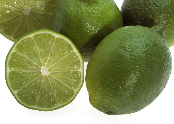 istock GREEN LEMON citrus aurantifolia AGAINST WHITE BACKGROUND 1227392877