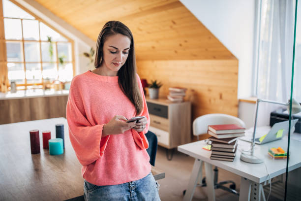 istock Young woman using smart phone 1227394593