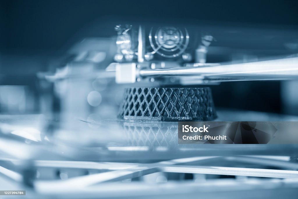 Close-up scene of 3D model printer operation . Close-up scene of 3D model printer operation . Hi-technology rapid prototype for design processing by 3D printing machine. 3D Printing Stock Photo