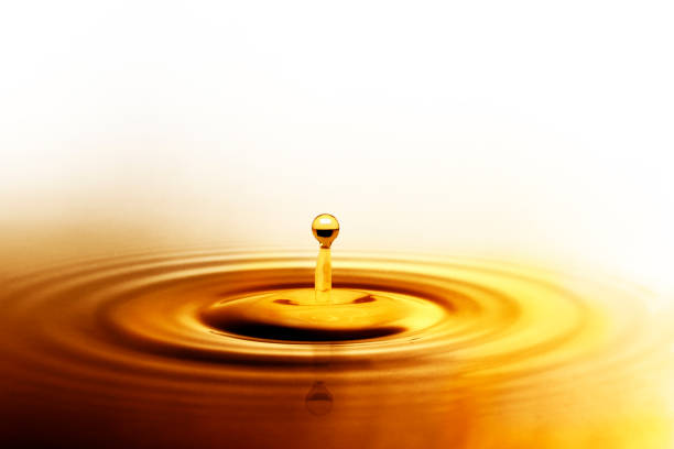 istock Liquid gold or olive oil drop and ripple wave,abstract background 1227394987