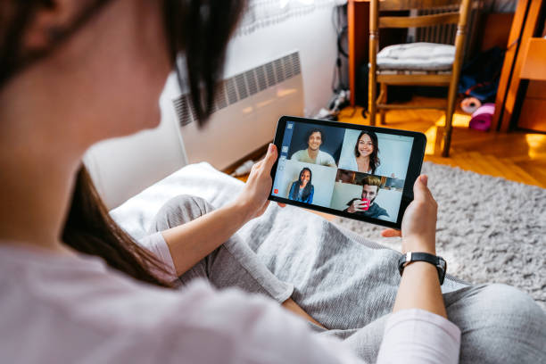 istock Woman having a video call with friends 1227394989