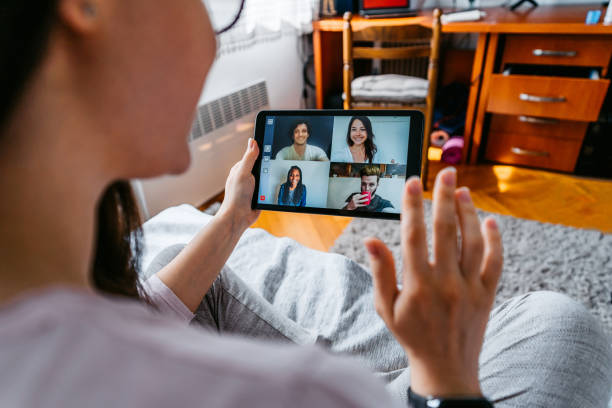istock Woman having a video call with friends 1227395056