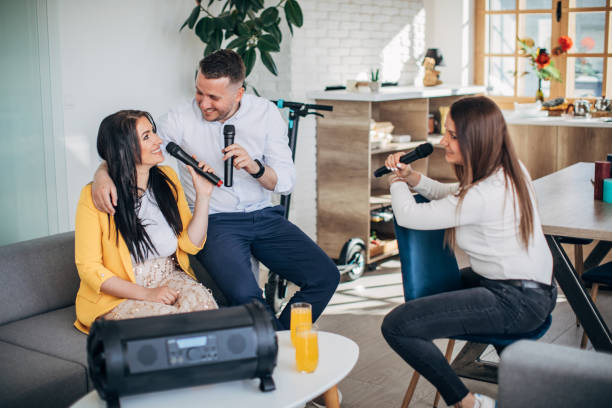 istock Friends having a karaoke party 1227395735