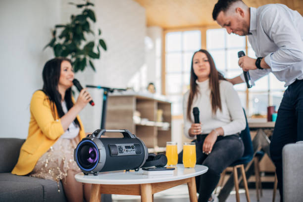 istock Friends having a karaoke party 1227396194