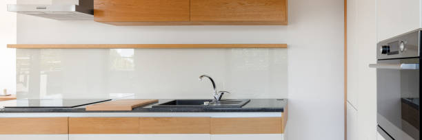 istock Kitchen in white and wooden, panorama 1227396342