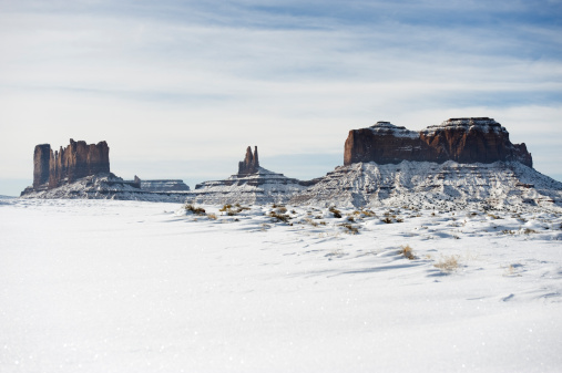 Stock photograph of long road leading towards Monument Valley as seen from Forrest Gump Point, Utah.