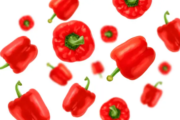Falling red bell peppers isolated on a white background with clipping path as package design element and advertising. Flying vegetables. Top view.