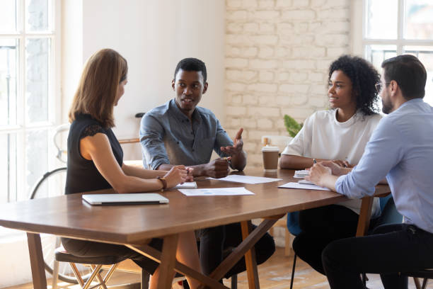istock Diverse business team sharing ideas at meeting, having fun 1227397600