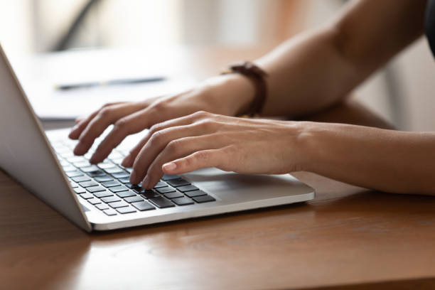 istock Close up female hands typing on keyboard, using laptop 1227397643