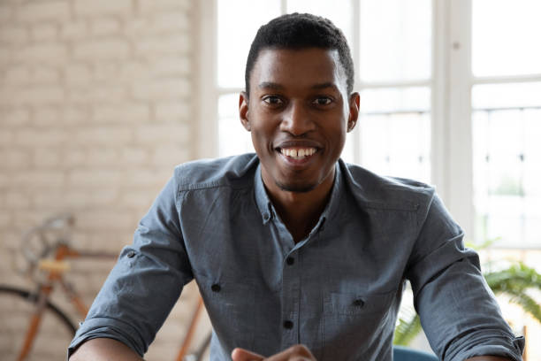 istock Head shot African American businessman using webcam, working online 1227397647
