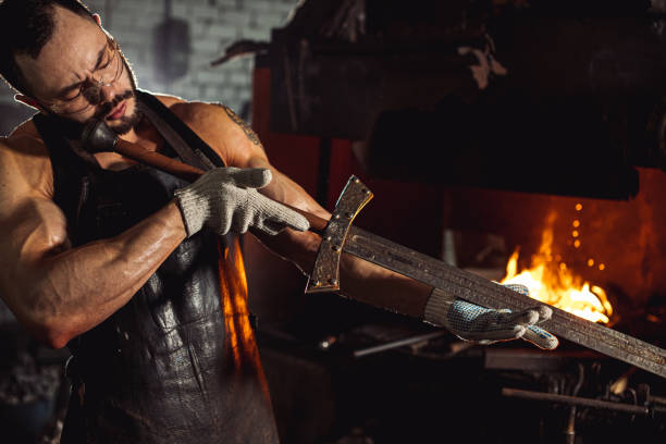 istock portrait of blacksmith studying handmade metal in workshop 1227399960