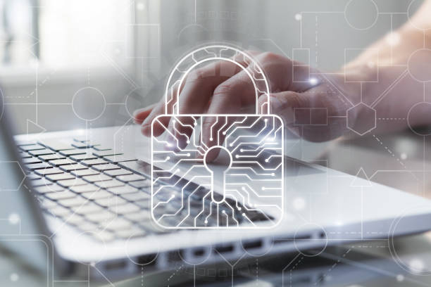 Cyber security and protection of private information and data concept. Bright big lock with integrated circuit on it. Person using computer on background. Safe payments concept. stock photo