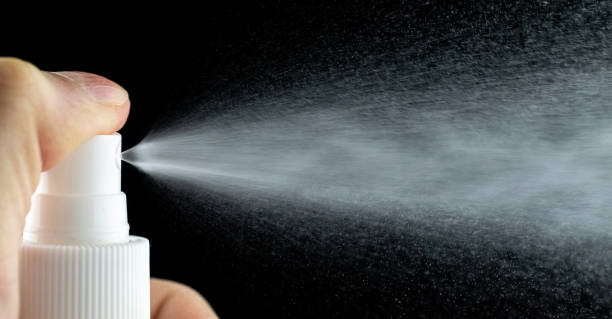 istock Water mist splash bottle isolated on black background. Spray liquid aerosol for perfume. 1227400452