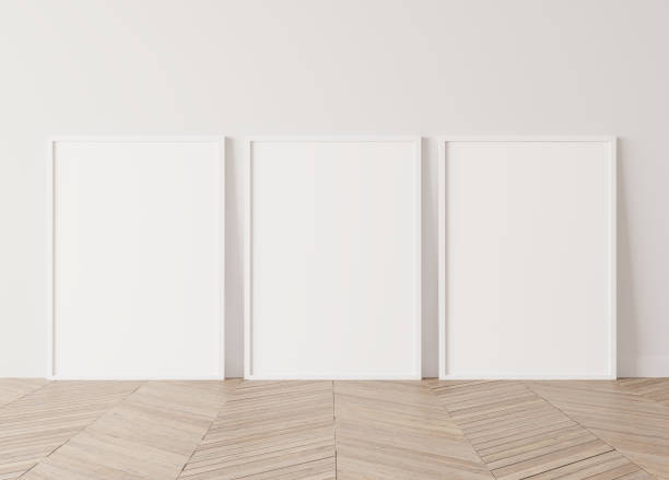Set of Three white vertical modern frames. Gallery wall mock up on Wooden floor . Parquet . Stock photo stock photo