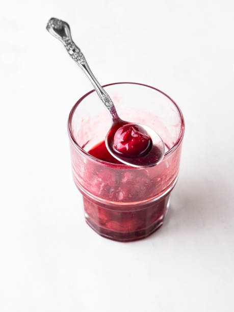 istock Cherry jam, Cherry Sauce, Sour cherries,Cherry jam with spoon 1227403646