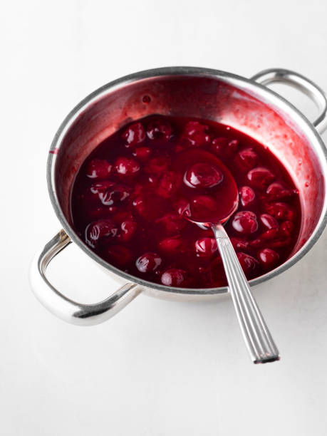 istock Cherry jam, Cherry Sauce, Sour cherries,Cherry jam with spoon 1227404491