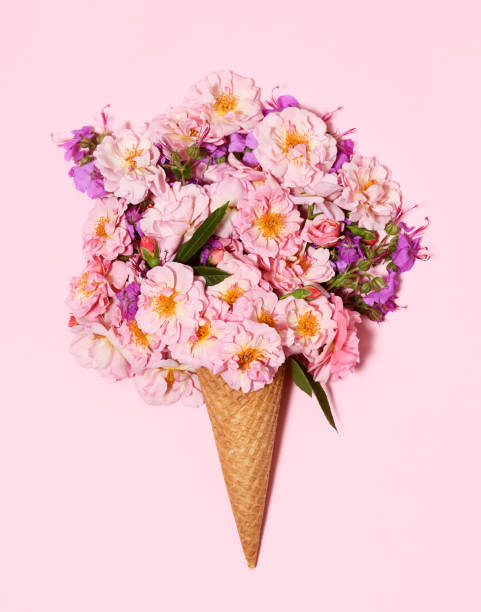 Beautiful bouquet in ice cream cone on pink