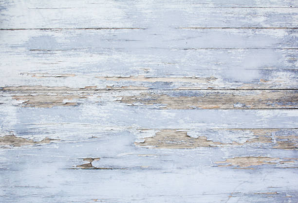 istock Old blue wooden boards with cracked and peeling paint texture background. 1227405083