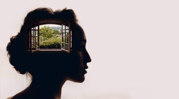 beautiful woman with opened window with garden in her head. - symbols of peace fotos imagens e fotografias de stock