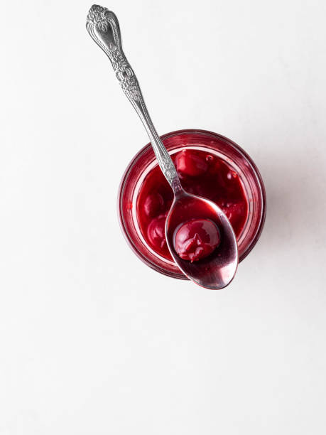 istock Cherry jam, Cherry Sauce, Sour cherries,Cherry jam with spoon 1227405897