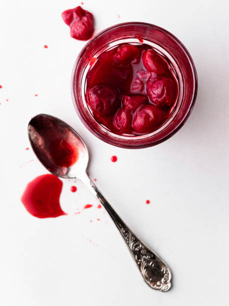 istock Cherry jam, Cherry Sauce, Sour cherries,Cherry jam with spoon 1227406286