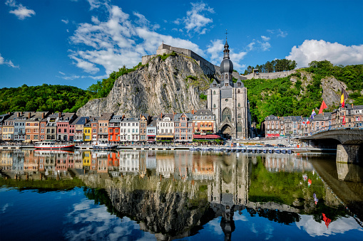 View of picturesque Dinant town, Dinant Citadel and Collegiate Church of Notre Dame de Dinant and Pont Charles de Gaulle bridge over the Meuse river. Belgian province of Namur, Blegium
