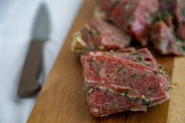 istock Raw meet slices on cutting board 1227407645