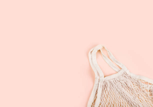 istock String shopping bag for purchases gently beige color on a light background. 1227409381