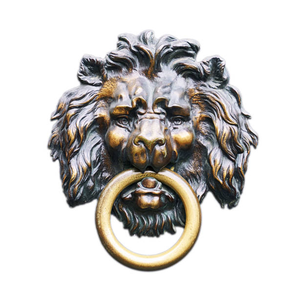 A lion door knocker on a residential entrance door in Central London, UK.