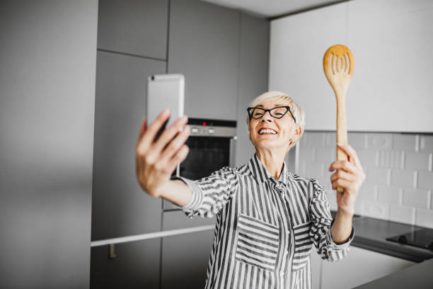 istock Senior woman vlogging 1227413025