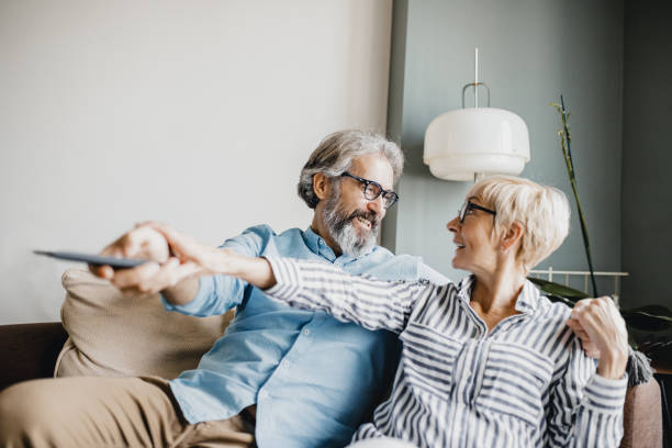 istock Senior couple at home watching TV 1227413219