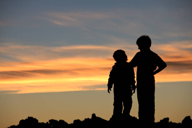 istock Two Young Friends Enjoying at Sunset 1227413231