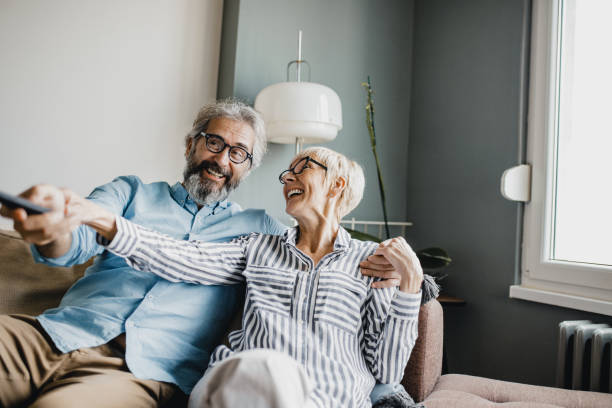 istock Senior couple at home watching TV 1227413302