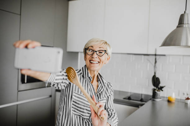 istock Senior woman vlogging 1227413331