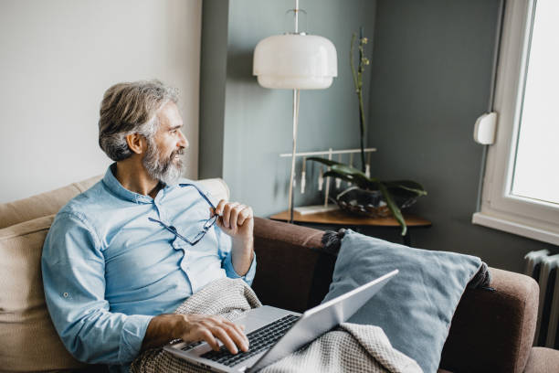 istock Mature man is working from home 1227414969