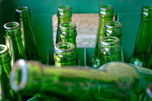 istock pack of Green beer empty  bottles in  green crate  close up, selective focus 1227419279