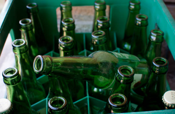 istock pack of Green beer empty  bottles in  green crate  close up, selective focus 1227419284