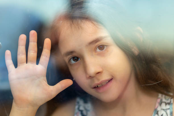 istock She is waiting for behind the window 1227420445