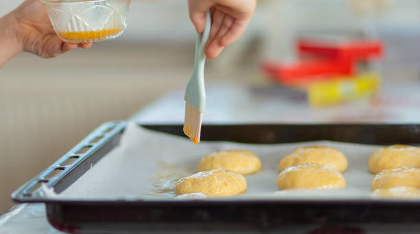 istock uncooked dough rolls on the tray with egg yolk 1227420555