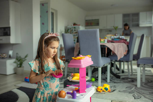 istock A child playing with a fake kitchen 1227422522